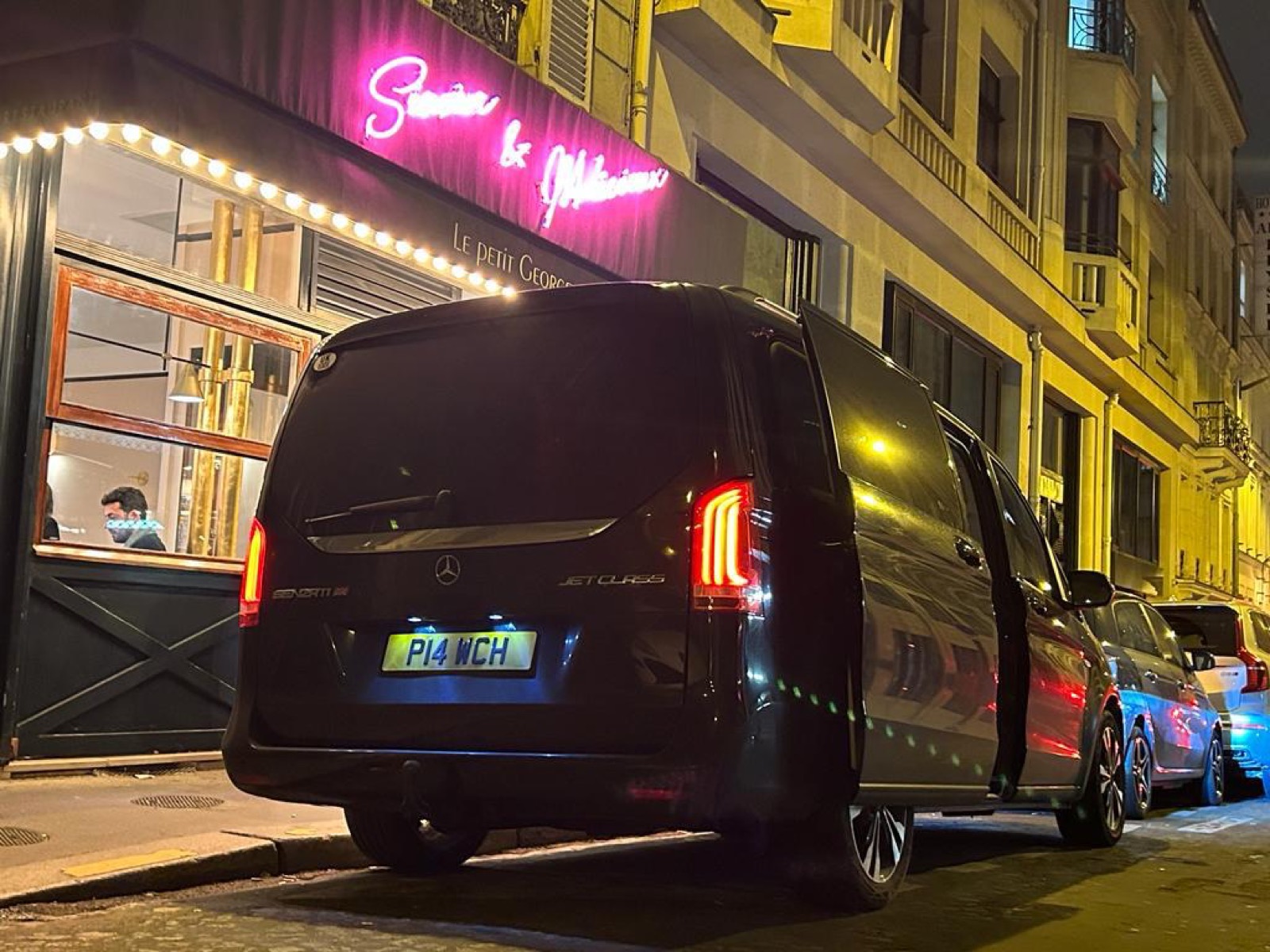 Black Mercedes chauffeur car outside an evening venue