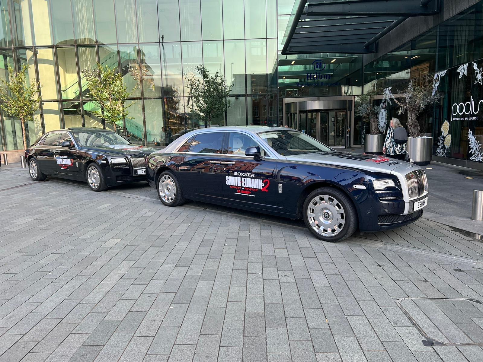 Black chauffeur cars outside a business venue