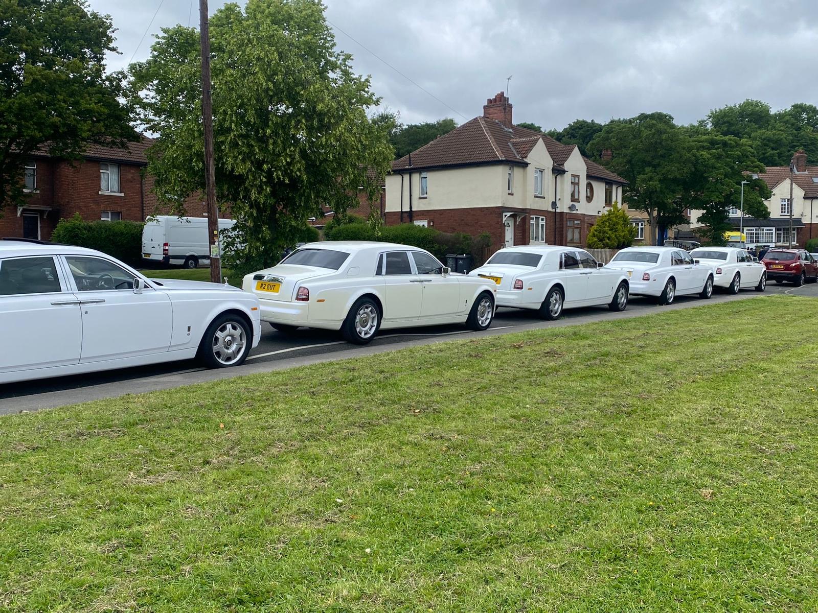 White chauffeur cars lined up for a race day booking